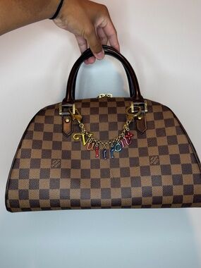 This Louis Vuitton Damier Ebene Ribera MM handbag